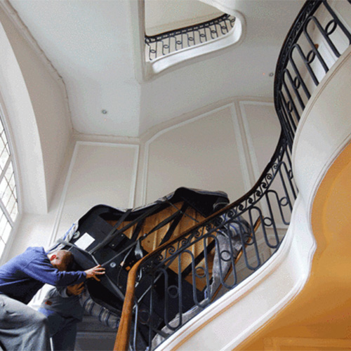 moving a piano up the stairs